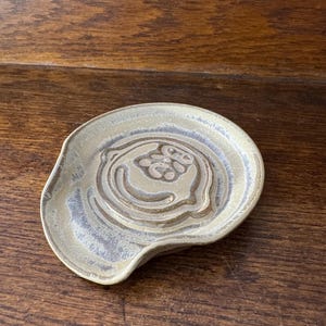 C.Brown ~ Widespread Panic spoon rest: Handmade, hand glazed blue/brown color over brown stoneware clay, signature stamp by artist.