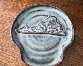 Virginia Spoon Rest: Handmade, hand glazed. Microwave and dishwasher safe. Blue/brown glaze over brown clay.   Artist signed