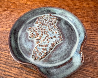 Ireland Spoon Rest: Handmade, hand glazed. Microwave and dishwasher safe. Blue/brown glaze over white stoneware clay.   Artist signed