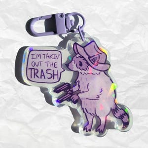 Takin&#39; Out the Trash Raccoon Keychain 2.5&quot;, raccoon keychain, acrylic keychain, funny gift, raccoon lover gift, cowboy, purple keychain