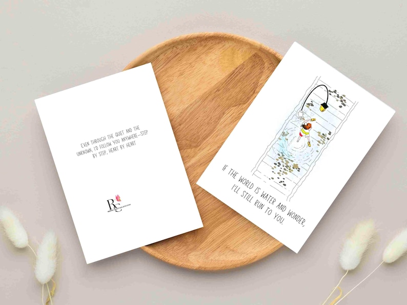 Greetings card with an illustration of Chihiro from Spirited away, Ghibli movie. She is running on rail tracks, which are under water, along with a walking street lamp. The card has a minimalist vibe with a phrase under the image that says " If the world is water and wonder, I will still run to you". The back of the card also has a phrase that says " Even through the quiet and the unknown, I'd follow you anywhere- step by step, heart by heart". It is a Studio Ghibli fan art greetings card.