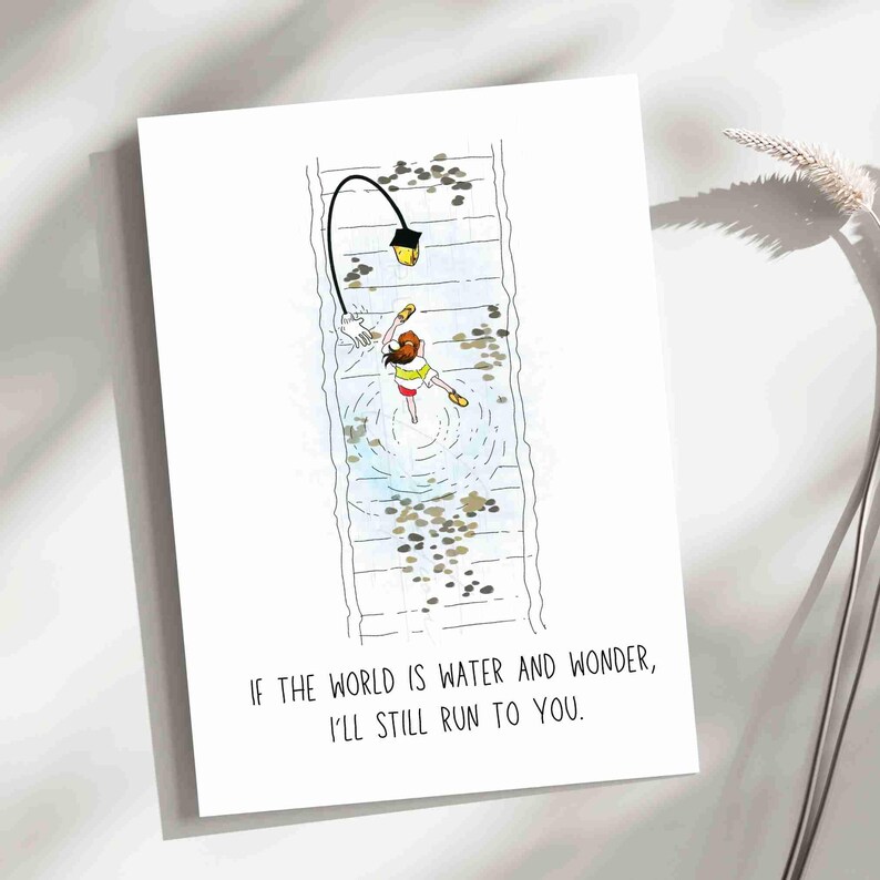 Greetings card with an illustration of Chihiro from Spirited away, Ghibli movie. She is running on rail tracks, which are under water, along with a walking street lamp. The card has a minimalist vibe with a phrase under the image that says " If the world is water and wonder, I will still run to you". The back of the card also has a phrase that says " Even through the quiet and the unknown, I'd follow you anywhere- step by step, heart by heart". It is a Studio Ghibli fan art greetings card.