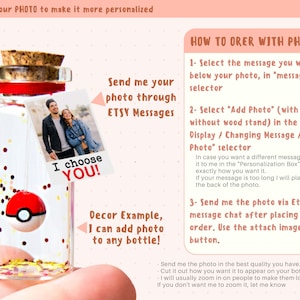 May include: A clear glass bottle with a cork stopper containing gold and red glitter and a small spherical red and white toy. A square photo print hangs from the bottle neck featuring a couple and the text I CHOOSE YOU! Text instructions for ordering with a photo are displayed on the right side.