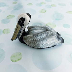 Gray, Black and White Pelican With Beige Beak/Bill Figurine