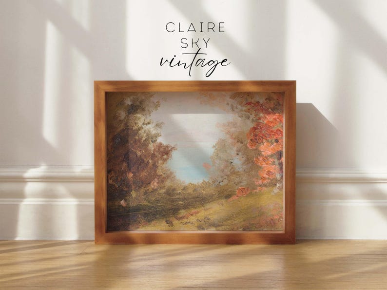 Puede incluir: Una pintura enmarcada de un paisaje con &aacute;rboles y un cielo azul. La pintura est&aacute; en un marco de madera y tiene un aspecto vintage. El texto "CLAIRE SKY vintage" est&aacute; impreso en el marco.