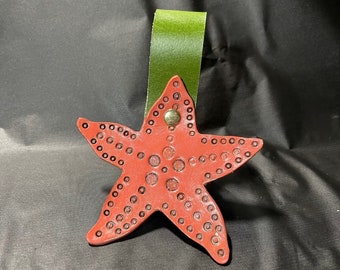 Falda de cuero con forma de estrella de mar hecha a mano para senderismo