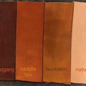 May include: Four leather swatches in different colors: mahogany, saddle tan, buckskin, and natural.