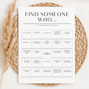 May include: A white rectangular game card titled Find Someone Who with a five-by-five grid of squares containing various prompts like Is Left Handed, Has Blue Eyes, and Has Met a Celebrity, with a central Free square and blank lines for initials.