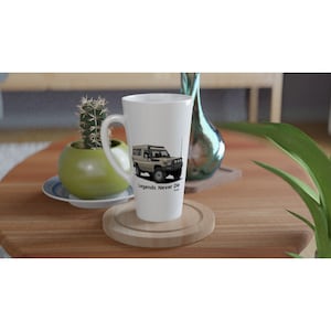 May include: White ceramic latte mug featuring a black and white illustration of a Toyota Land Cruiser with the text "Legends Never Die" printed on the side.