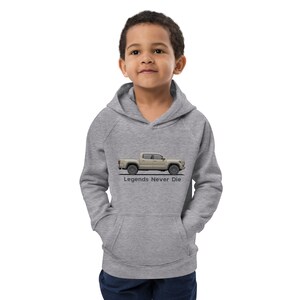 May include: A gray hooded sweatshirt with a side profile of a light brown pickup truck and the text "Legends Never Die" printed on the front.