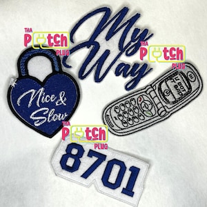 May include: A collection of embroidered patches in various shapes and designs. Includes a blue heart-shaped lock with "Nice & Slow" text, a "My Way" script, a flip phone, and a patch with the number "8701".