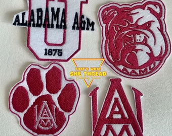 May include: Four embroidered patches featuring the logos of Alabama A&M University. The patches are white and maroon with the university's name and mascot. The patches are perfect for adding a touch of school spirit to your belongings.