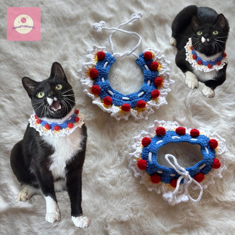 May include: Three crochet cat collars in a Snow White theme. The collars are white with a blue center, red pom-poms, and yellow accents. Two black and white cats are wearing the collars. The image includes the text "HannaTreasures".