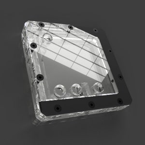 May include: A clear acrylic water cooling reservoir with a black trim and multiple screw holes. The reservoir has a grid pattern on the front.