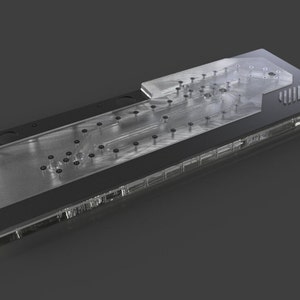 May include: A clear acrylic water cooling plate with a black metal base and multiple screw holes. The plate has a complex channel design for water flow.