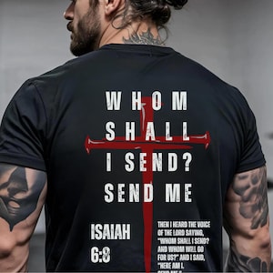 May include: A black short-sleeved t-shirt featuring a large red cross graphic behind white text that reads "WHOM SHALL I SEND? SEND ME" and "ISAIAH 6:8" along with a block of smaller white text quoting the scripture passage from the Bible.