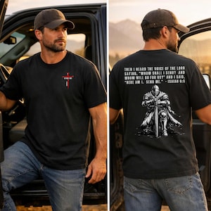 May include: A black short-sleeve t-shirt featuring a small red cross graphic on the front chest with the text "SEND ME". The back displays a graphic of a knight kneeling with a sword and the text "THEN I HEARD THE VOICE OF THE LORD SAYING, "WHOM SHALL I SEND? AND WHOM WILL GO FOR US?" AND I SAID, "HERE AM I. SEND ME." - ISAIAH 6:8".