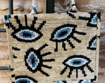 Böses Auge Ikat Einkaufstasche, Weiß Evil Eye Ikat Einkaufstasche - Handgemachte Seidensamt-Tasche mit Reißverschluss und Taschen, blaues Auge Beuteltasche