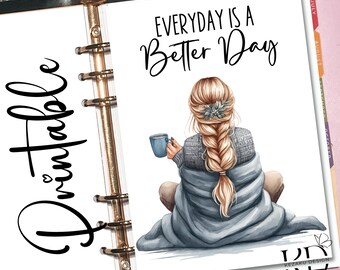 May include: Printable planner page featuring a woman sitting with a cup of coffee, wrapped in a blanket, with the text "Everyday is a Better Day".