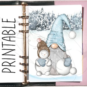 May include: A printable planner page featuring a blue and white gnome and a snowman holding snowballs in a snowy winter forest setting.