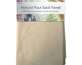 May include: A natural beige flour sack towel, folded and packaged. The packaging has the text "Natural Flour Sack Towel" and "100% Cotton. Processed in the USA. Pre-washed".