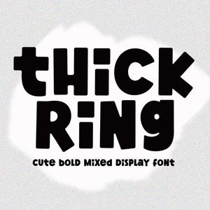 May include: Black text on a white background reads "THICK RING" in a bold, rounded font. Below, smaller text says "CUTE BOLD MIXED DISPLAY FONT". The background is a textured, light gray.
