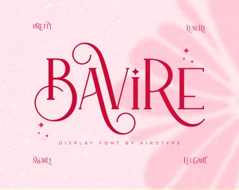 May include: A display font design with the name "BAVIRE" in a bold, elegant, red script. The font is set against a soft pink background with the words "Pretty", "Luxury", "Swirly", and "Elegant" surrounding the font.