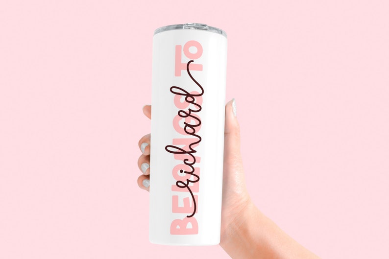 May include: White stainless steel tumbler with a pink and black design that says "Beach Mode On".