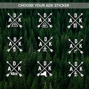 May include: Nine different designs for Adirondack (ADK) stickers. Each sticker features a white outline of a compass with arrows pointing in opposite directions, the letters "ADK" in the center, and a different icon in the center of the compass. The icons include a tent, a mountain with "NY" on it, a person hiking, a person with a backpack, a person running, a person skiing, the number "46er", the outline of New York State, and a person with a fishing rod.