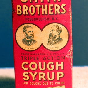 Vintage Smith Brothers hostmedicinflaska med ask från 1930-talet