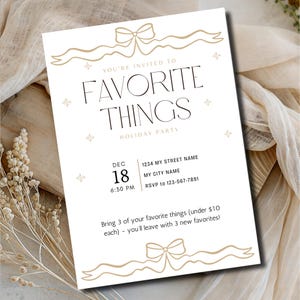 May include: A white invitation card with gold accents. The text reads "FAVORITE THINGS HOLIDAY PARTY" with event details. The card is decorated with bow and ribbon designs.