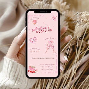 May include: A smartphone displays a pink Galentine's Bookclub invitation. The design includes a rose, hearts, a bird, and champagne glasses. Text reads "You're Invited," "Bubbly & Books!" and details for the event on February 14th.