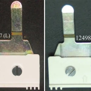 May include: Two white plastic electrical components with metal parts. The component on the left has the number 12498507 (L) printed on it. The component on the right has the number 12498499 (R) printed on it.