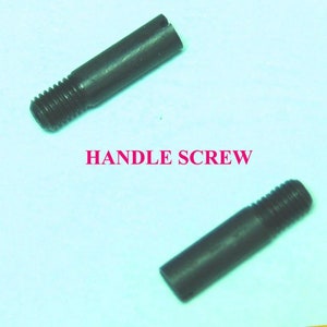 May include: Two black metal handle screws. The screws are approximately 2 inches long and have a threaded end.