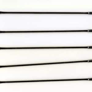 May include: Five black metal needles with eye holes at both ends.