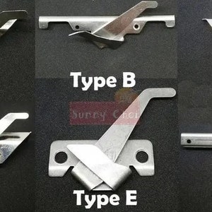 May include: Six different types of metal sewing machine parts labeled A through F. The parts are silver in color and have various shapes and sizes.