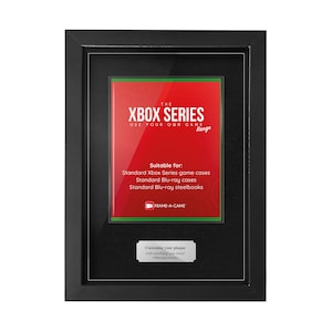 May include: A framed display featuring a red and green insert with the text "XBOX SERIES" and "USE YOUR OWN GAME Range". The frame is black and includes a small plaque at the bottom. Suitable for Xbox Series game cases, Blu-ray cases, and steelbooks.