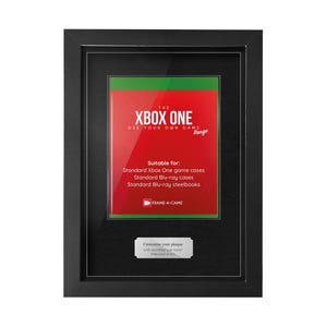 May include: A black framed display case featuring a red and green insert with the text "XBOX ONE". The display is designed to hold Xbox One game cases, Blu-ray cases, and steelbooks. A small plaque at the bottom reads "Customize your plaque with anything you want!"