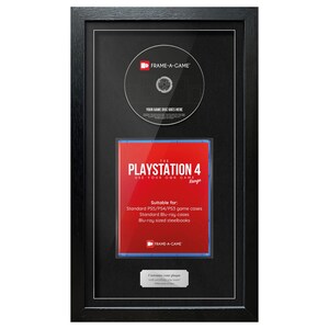May include: Black framed display for a video game disc and case. The top section holds a disc, and the bottom section displays a red PlayStation 4 game case. Text on the case reads "PLAYSTATION 4 USE YOUR OWN GAME".