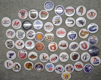 A set of vintage badges of hockey clubs from around the world, including the NHL, KHL, and German leagues. 53psc in lot