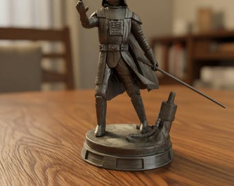 May include: A monochromatic gray figurine of a character wearing a helmet, chest armor, and a cape. The figure stands on a circular base with one arm extended forward and the other holding a thin, straight rod, with a mechanical component nearby.