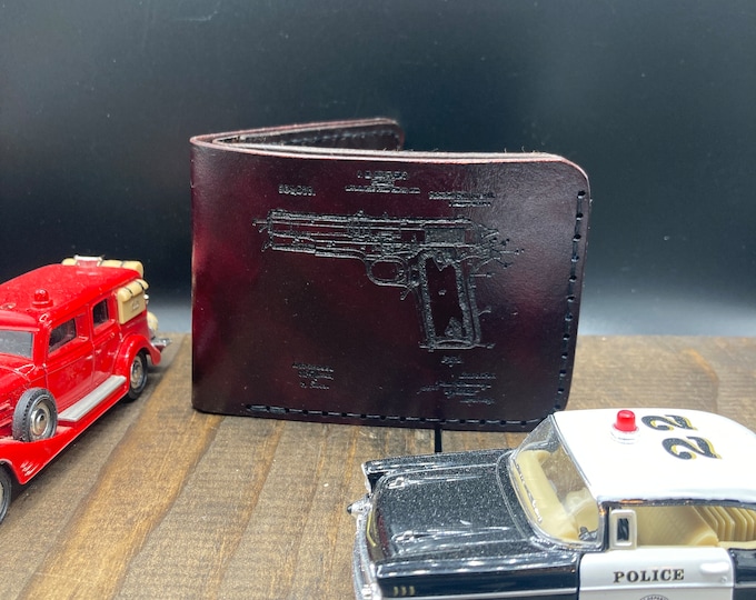 Bi-fold hand made leather wallet, with 1911 graphic.