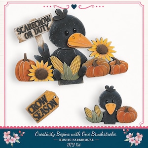 May include: A DIY craft kit featuring two black crow cutouts with orange beaks, pumpkins, sunflowers, and corn cobs. One crow holds a sign reading "SCARECROW ON DUTY" and a separate tag reads "CROW SEASON". The pieces are painted in autumn colors.