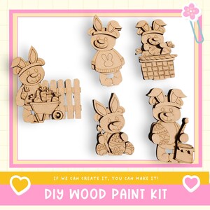 May include: A DIY wood paint kit featuring six wooden bunny figures in various poses, including one with a wheelbarrow and another with a paint bucket. The kit includes the text "IF WE CAN CREATE IT, YOU CAN MAKE IT!" and "DIY WOOD PAINT KIT".