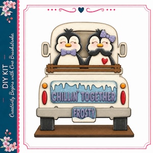 May include: A wooden DIY kit featuring a white truck with two penguins in the back. The penguins wear a purple bow tie and a purple polka dot bow. The truck tailgate displays the text CHILLIN' TOGETHER and FROSTY in purple lettering.