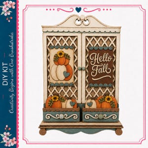 May include: A wooden DIY kit cabinet featuring a lattice design, two drawers, and decorative panels. The left panel displays pumpkins and sunflowers, while the right panel features the text Hello Fall. The piece is painted in cream, blue, and orange.