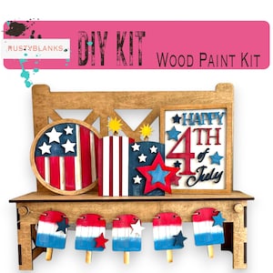 May include: A wooden DIY paint kit featuring patriotic decorations. Includes a bench, a circular American flag, a rectangular design with stars, and a framed "Happy 4th of July" sign. Also includes popsicle decorations. The kit is designed for painting.