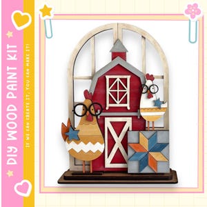 May include: DIY wood paint kit featuring a red barn with a white door and window, and two chickens wearing glasses. The chickens are holding blue stars. The kit includes the text "DIY WOOD PAINT KIT" and "IF WE CAN CREATE IT, YOU CAN MAKE IT!"