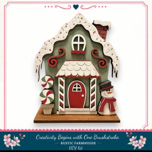 A wooden gingerbread house with a snowman and candy cane decorations, set against a white background.