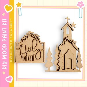 two wooden cutouts of a church and a sign with the word "HOLY" carved into it.